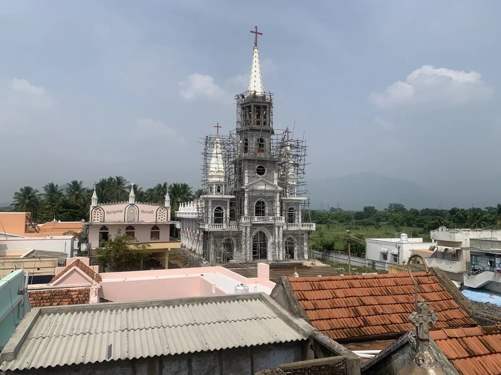 The shrine tower over village rooftops